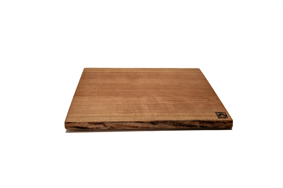 http://andrewpearcebowls.com/cdn/shop/files/Large-Double-Live-Edge-Wood-Cutting-Board-in-Cherry_1200x1200.jpg?v=1697040547