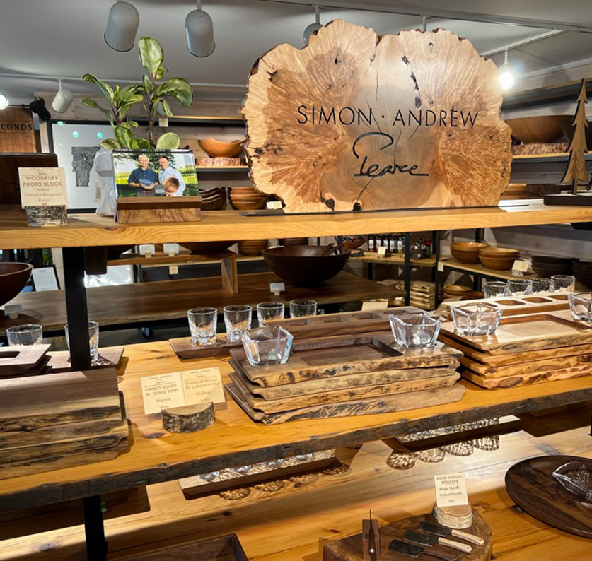 Interior of our gift shop in Hartland VT display of Simon Pearce and Andrew Pearce collaboration products dunmore boards and pinneo boards in walnut and cherry