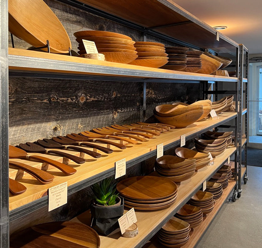 Hartland VT Gift Shop interior display of wood salad servers, wood salad bowls and wood round serving platters