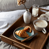 Wooden tray shown serving breakfast