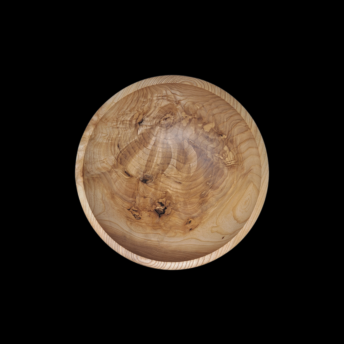 Wooden burl bowl with natural grain and texture on a black background, a perfect luxury gift