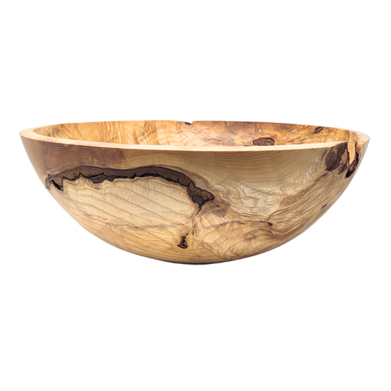 Wooden bowl with natural live edge on a white background
