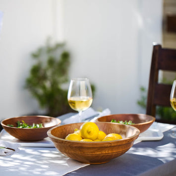 outdoor table settings with wooden bowls