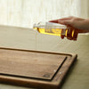 Food Safe Wood Finish Oil Being applied to an Andrew Pearce Bowls Wood Cutting Board